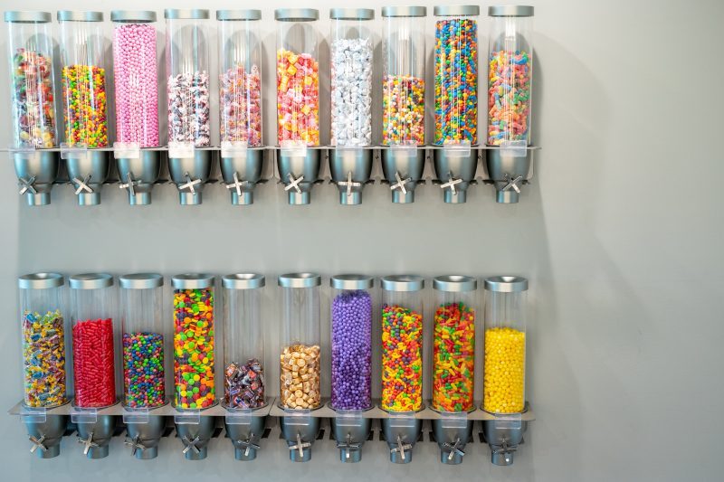 Candy wall with dispensers of colorful candy