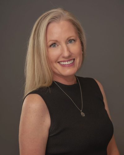 Ryanne Casteel smiling, wearing a black top
